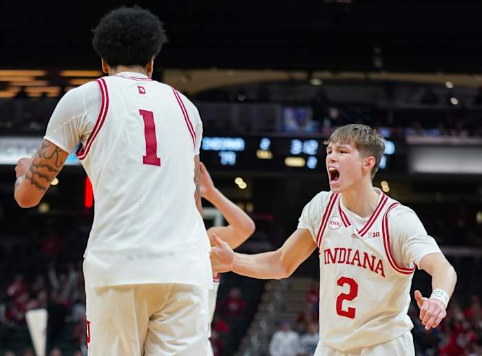 Indiana Hoosiers guard Gabe Cupps (2) celebrates with Indiana Hoosiers center Kel'el Ware (1) after a basket during the game against Harvard in Gainbridge Fieldhouse in Indianapolis, Ind. on Sunday, Nov. 26, 2023.